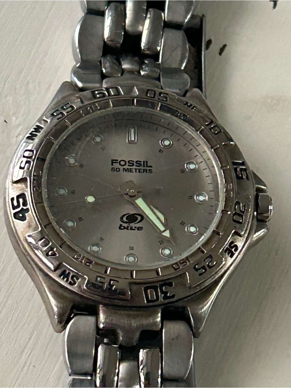Fossil Blue stainless steel wristwatch w/champagne dial and a rotating bezel